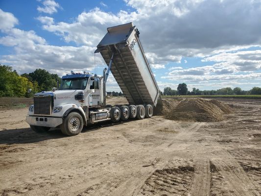 Dump truck delivering materials